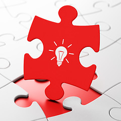 Image showing Business concept: Light Bulb on puzzle background