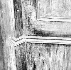 Image showing grain texture of a brown antique wooden old door in italy   euro