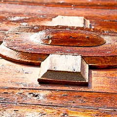 Image showing grain texture of a brown antique wooden old door in italy   euro