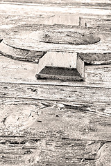 Image showing grain texture of a brown antique wooden old door in italy   euro