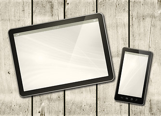 Image showing Smartphone and digital tablet PC on a white wood table