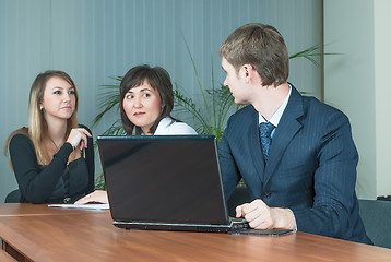 Image showing Businessman talks with colleagues in office