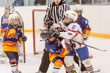 Image showing Fighting players of children hockey