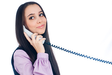 Image showing Attractive woman answering phone and smiling