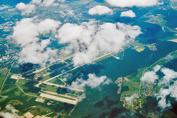 Image showing Aerial view on international airport under clouds