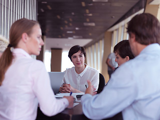 Image showing business people group on meeting at bright modern office