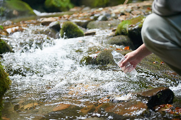 Image showing man drinking fresh water from spring