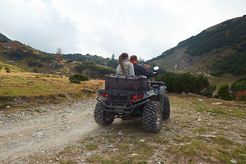 Image showing couple drive atv quad bike