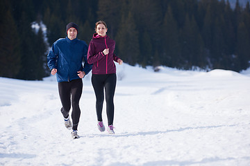 Image showing couple jogging outside on snow