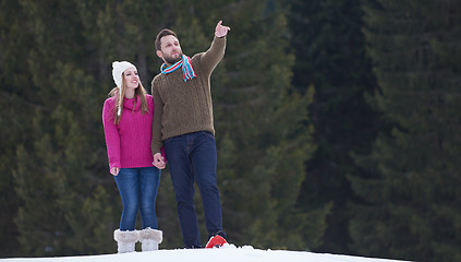 Image showing couple having fun and walking in snow shoes