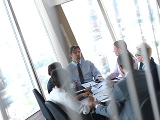 Image showing business people group on meeting at bright modern office