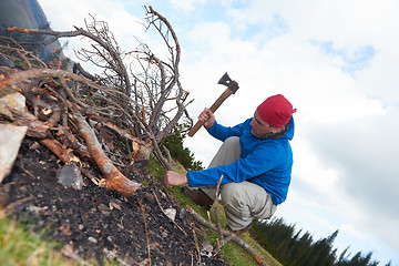 Image showing hiking man try to light fire