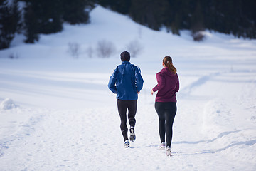 Image showing couple jogging outside on snow