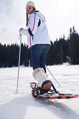 Image showing couple having fun and walking in snow shoes