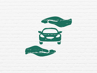 Image showing Insurance concept: Car And Palm on wall background