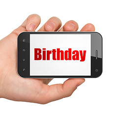 Image showing Holiday concept: Hand Holding Smartphone with Birthday on display