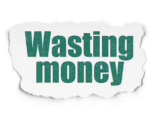 Image showing Money concept: Wasting Money on Torn Paper background