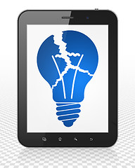 Image showing Finance concept: Tablet Pc Computer with Light Bulb on display