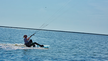 Image showing young woman kite-surfer