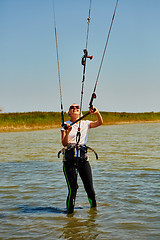 Image showing young woman kite-surfer