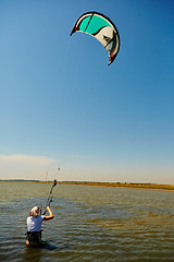 Image showing young woman kite-surfer