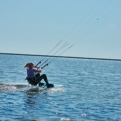 Image showing young woman kite-surfer