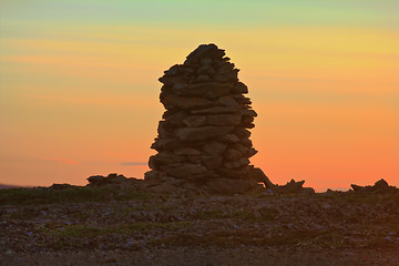 Image showing Built from stone Cairn at sunset, at midnight, the polar day