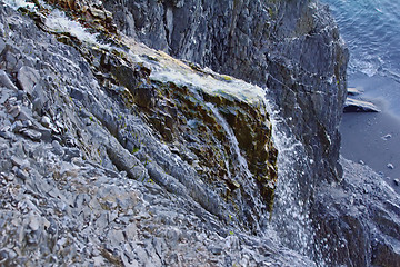 Image showing Rocky cliffs of Novaya Zemlya archipelago in Barents sea and waterfalls