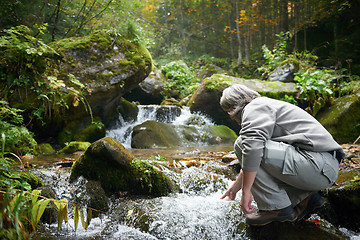 Image showing man drinking fresh water from spring