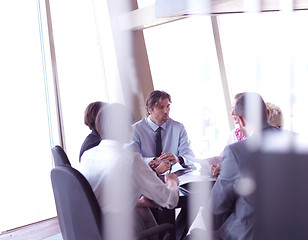 Image showing business people group on meeting at bright modern office