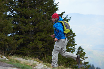 Image showing advanture man with backpack hiking