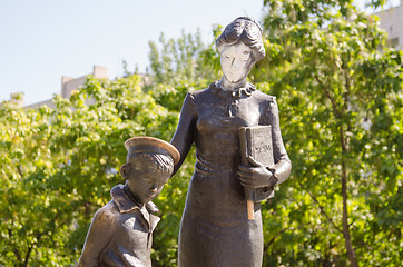 Image showing Vandals painted over with white paint face first teacher, a monument to the first teacher Volgograd