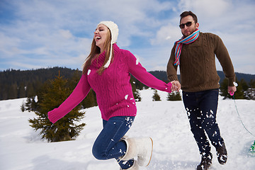 Image showing happy young couple having fun on fresh show on winter vacation