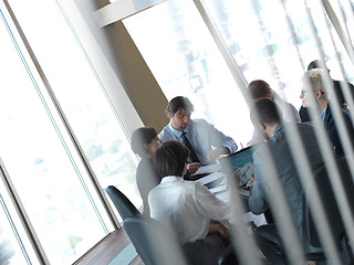 Image showing business people group on meeting at bright modern office