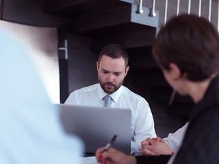 Image showing business people group on meeting at bright modern office