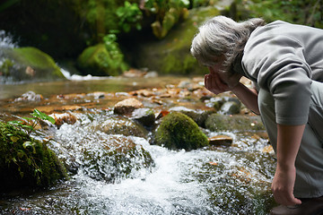 Image showing man drinking fresh water from spring