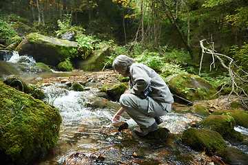 Image showing man drinking fresh water from spring