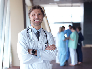 Image showing group of medical staff at hospital, doctor in front of team