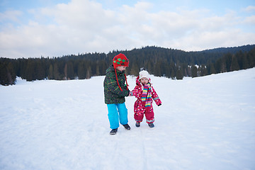 Image showing kids walking on snow