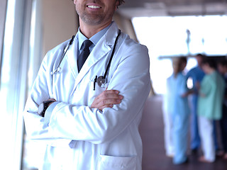 Image showing group of medical staff at hospital, doctor in front of team