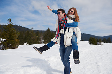 Image showing happy young couple having fun on fresh show on winter vacation