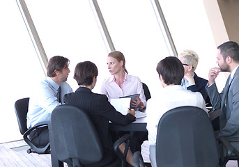 Image showing business people group on meeting at bright modern office