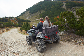 Image showing couple drive atv quad bike