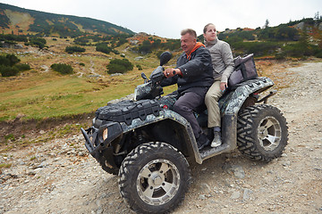 Image showing couple drive atv quad bike