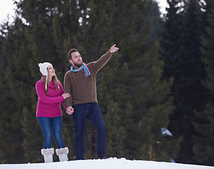 Image showing couple having fun and walking in snow shoes