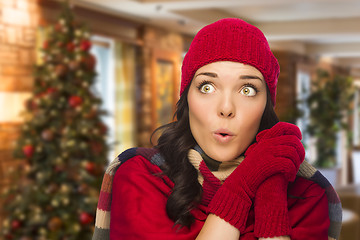 Image showing Mixed Race Woman Wearing Mittens and Hat In Christmas Setting