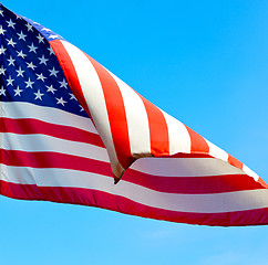 Image showing usa waving flag in the blue sky bcolour and wave