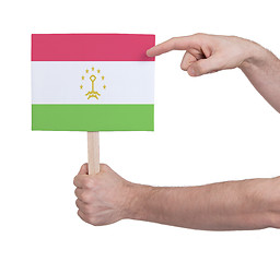 Image showing Hand holding small card - Flag of Tajikistan