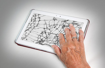 Image showing Senior lady with tablet, cracked screen