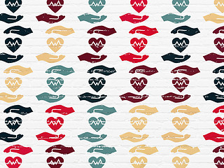 Image showing Insurance concept: Heart And Palm icons on wall background